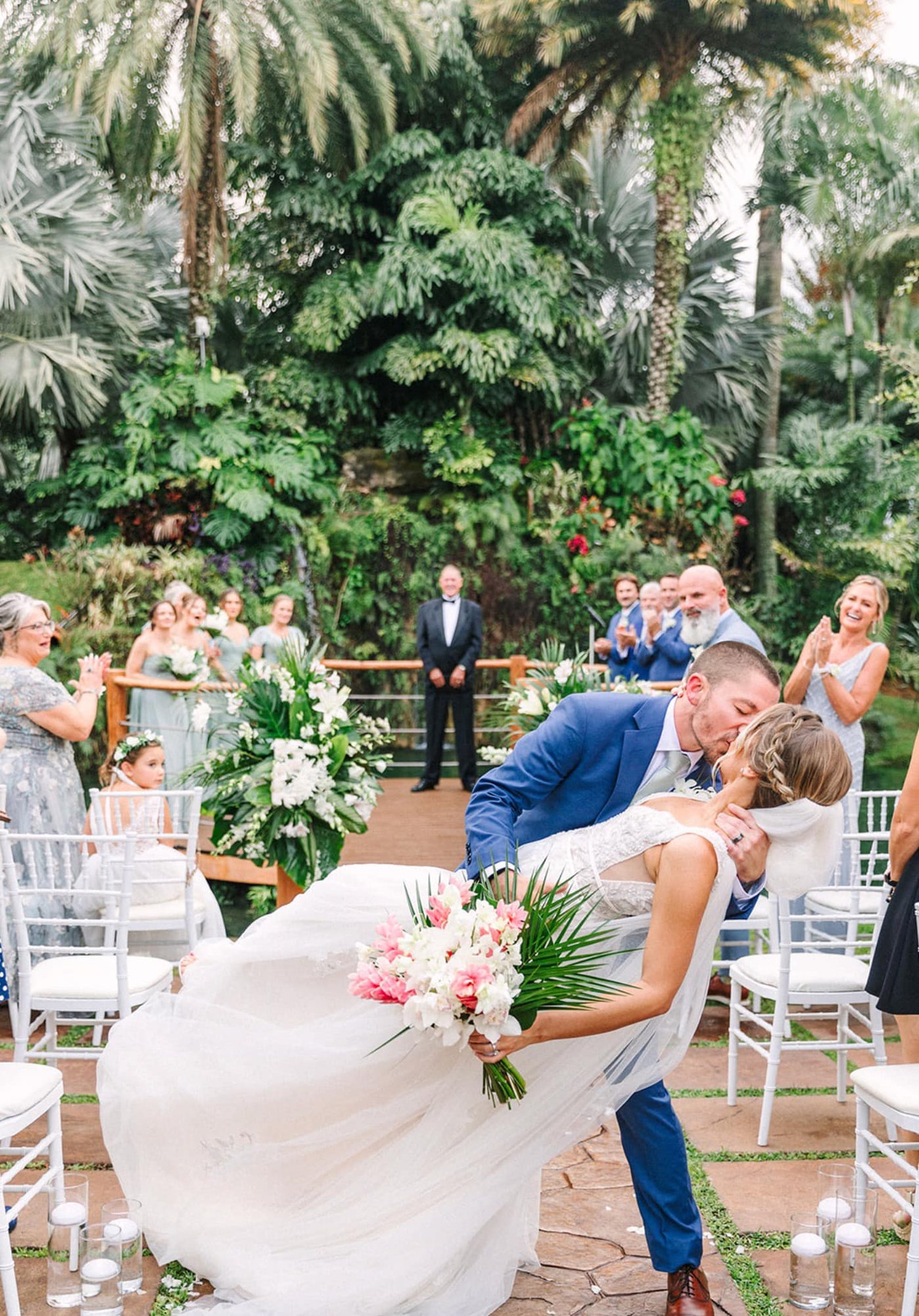 Wedding ceremony with lush white floral installation
