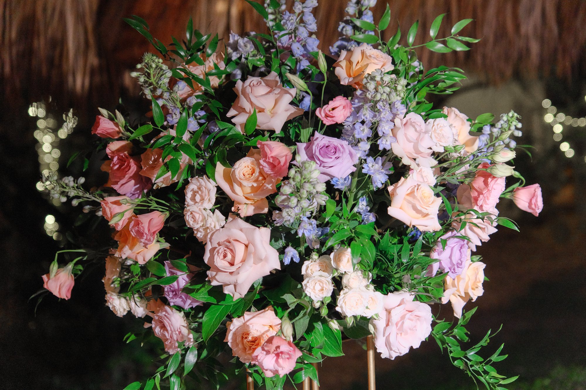 Abundant pink and blush floral centerpiece with greenery